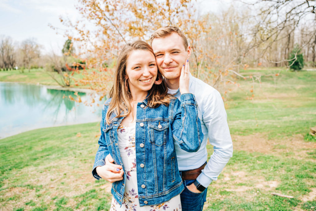 Madeline a midwest and Indiana engagement photographer, poses with her recent fiance for a photo
